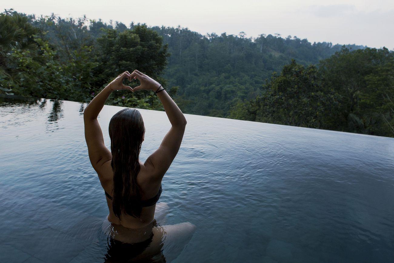 A woman meditating in a pool, illustrating stress relief from mindfulness for relaxation and the versatility of meditation techniques