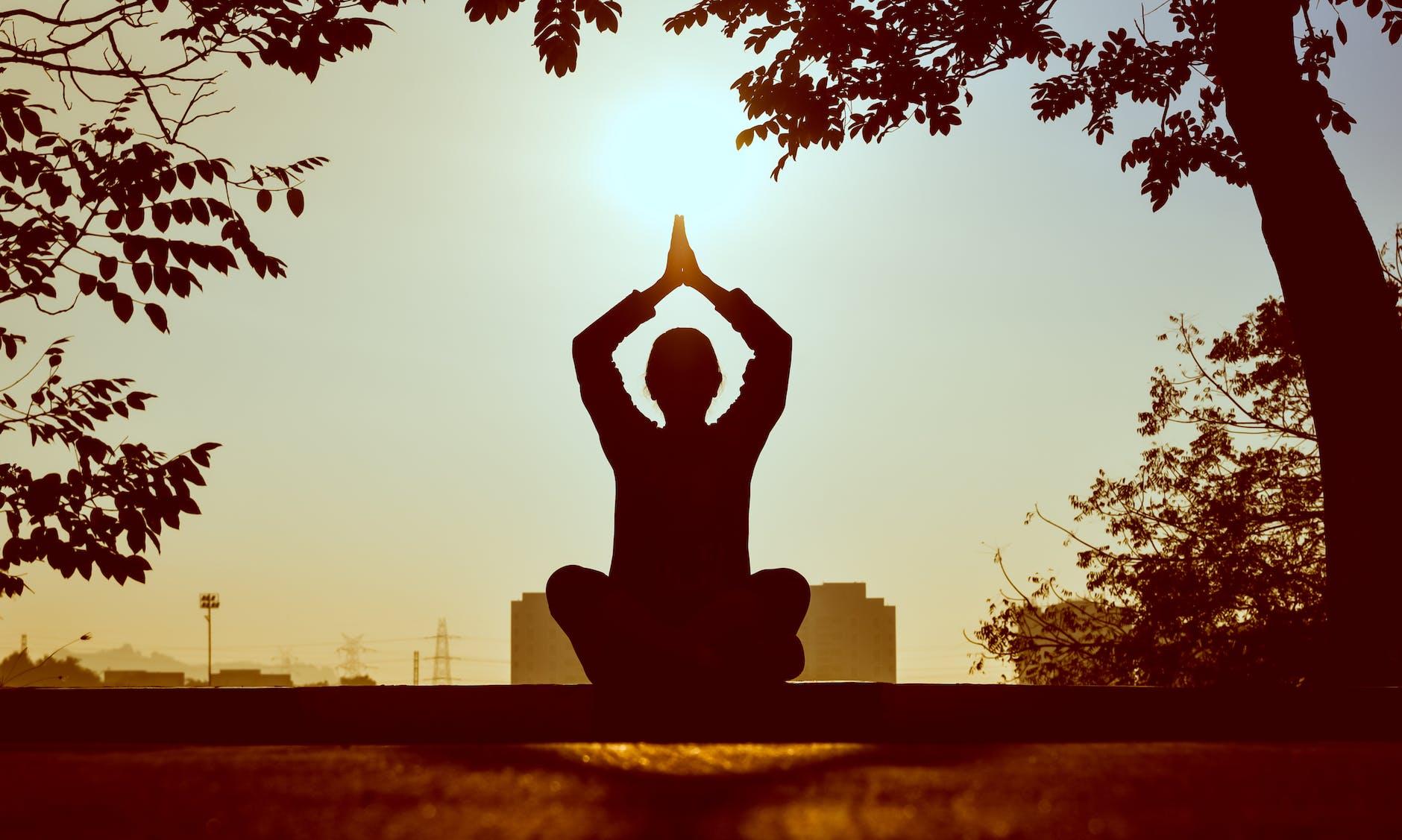 silhouette of man at daytime, exploring types of meditation and meditation techniques, as well as the benefits of meditation, mindfulness meditation, and how to meditate