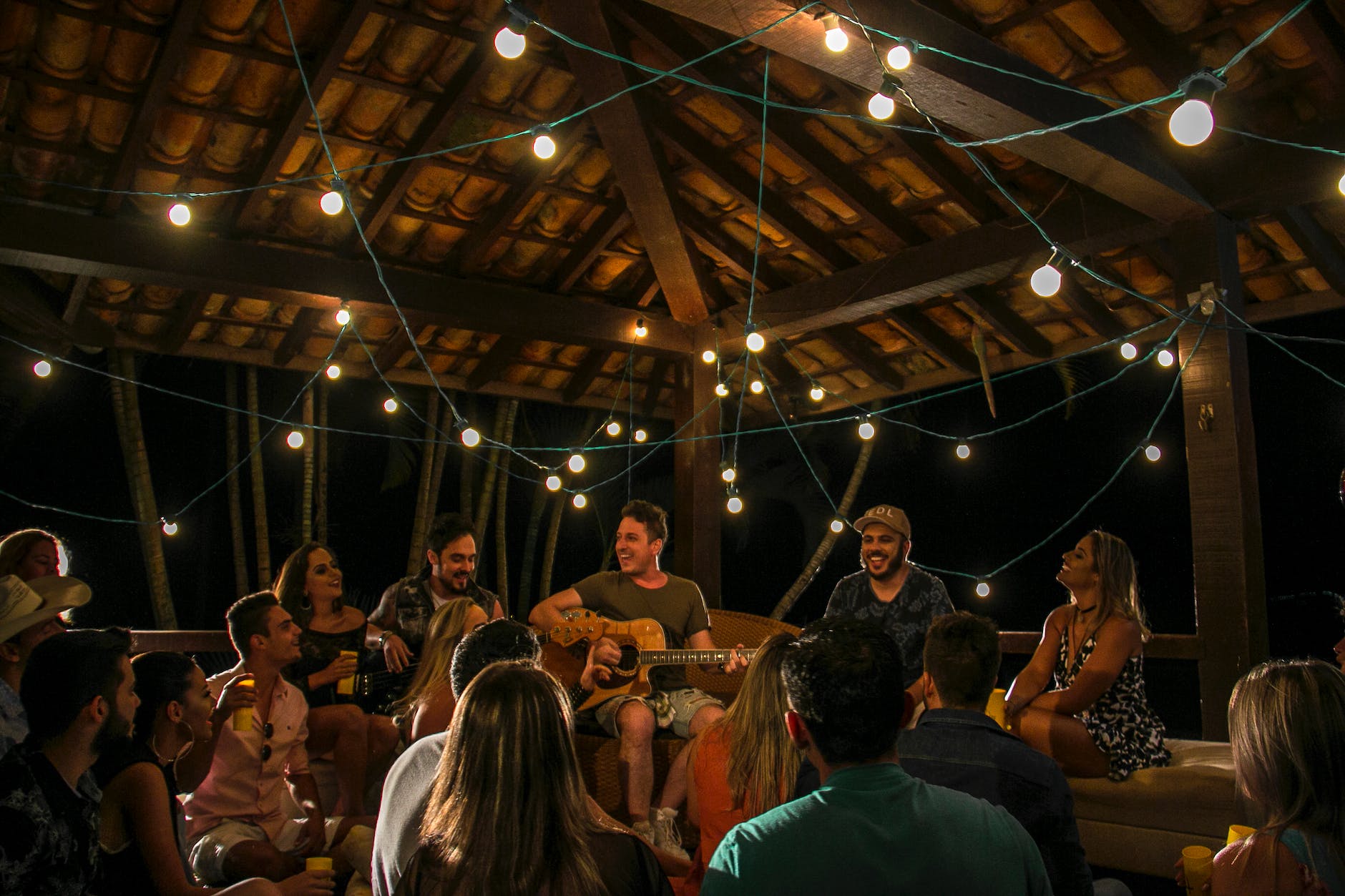 people gathering in room for Lughnasadh, first harvest, abundance festivals, to celebrate harvest and honor seasonal traditions