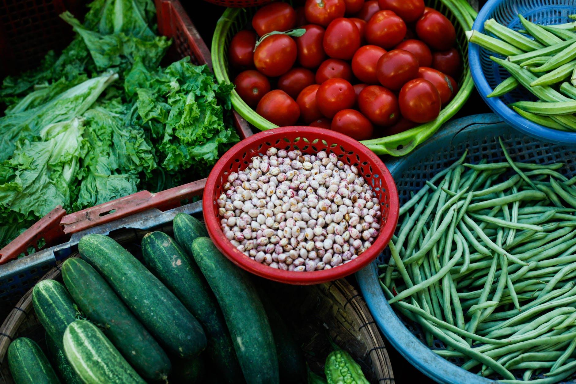 assorted vegetables on plastic trays for Lughnasadh, first harvest, abundance festivals, to celebrate harvest and honor seasonal traditions