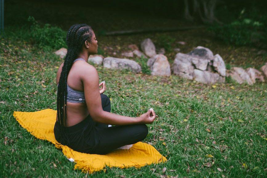 photo of woman doing meditation for stress relief and emotional resilience