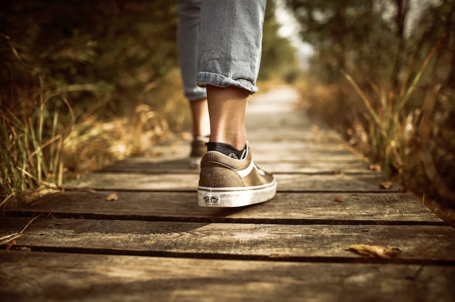 person stands on brown pathway, illustrating the diversity of meditation techniques and mindfulness for relaxation