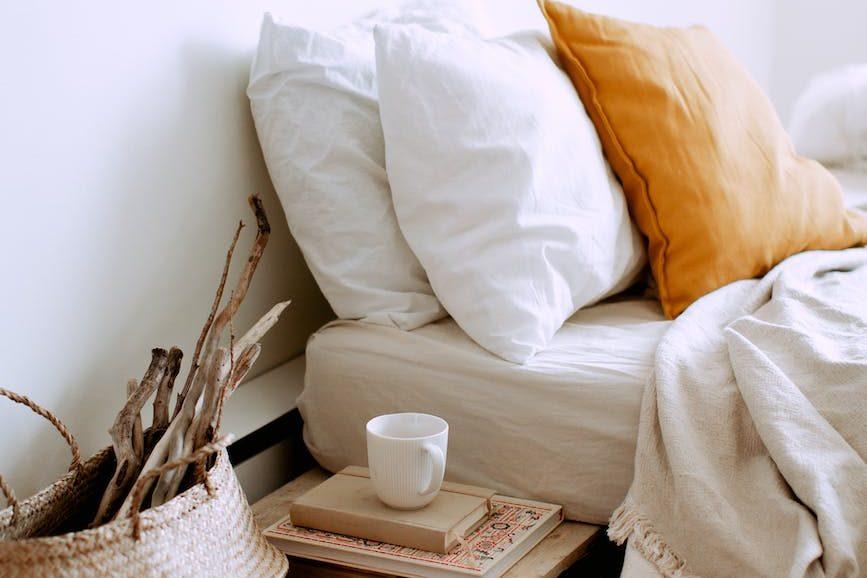 white ceramic mug on brown wooden table