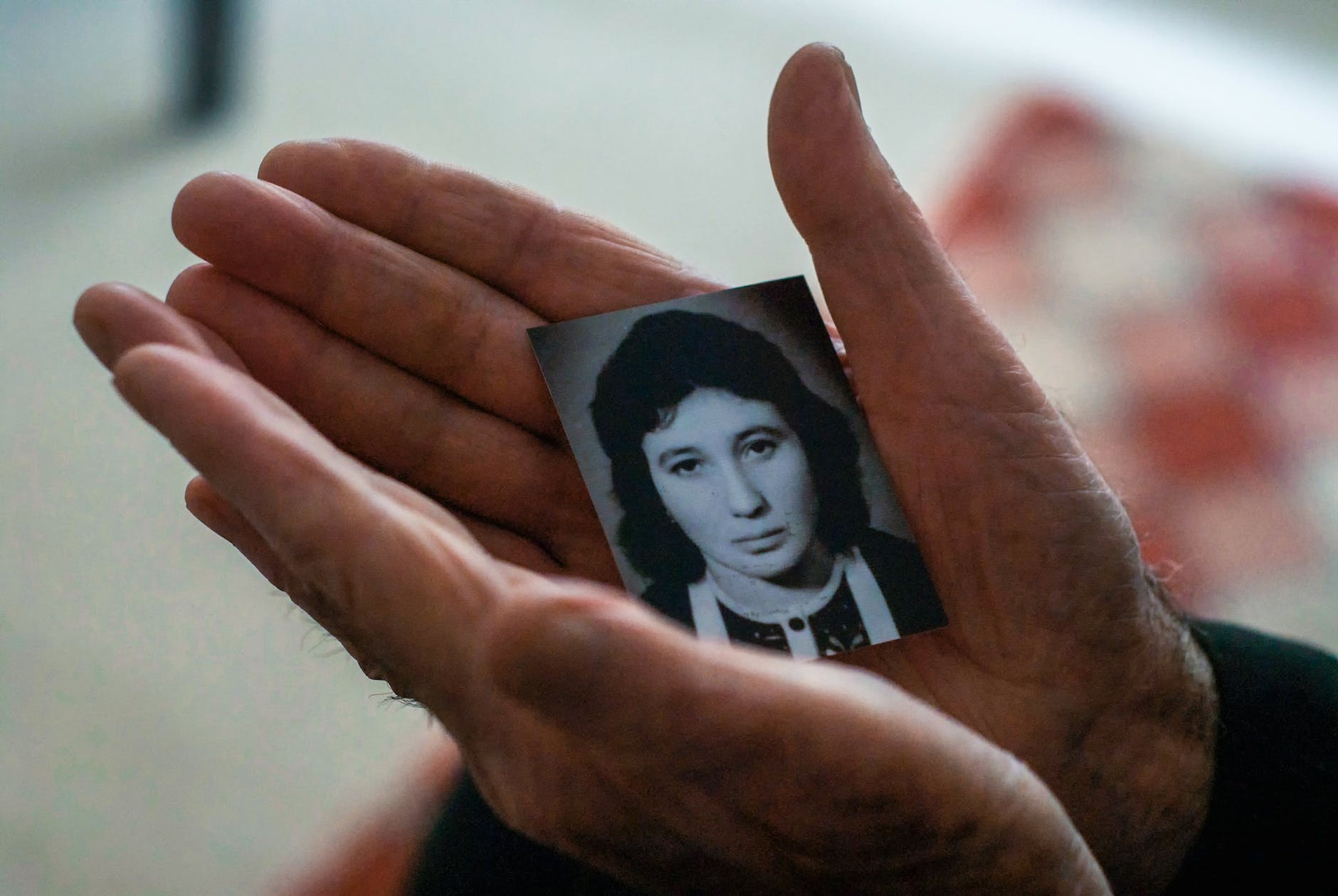 crop elderly man with photo of beloved