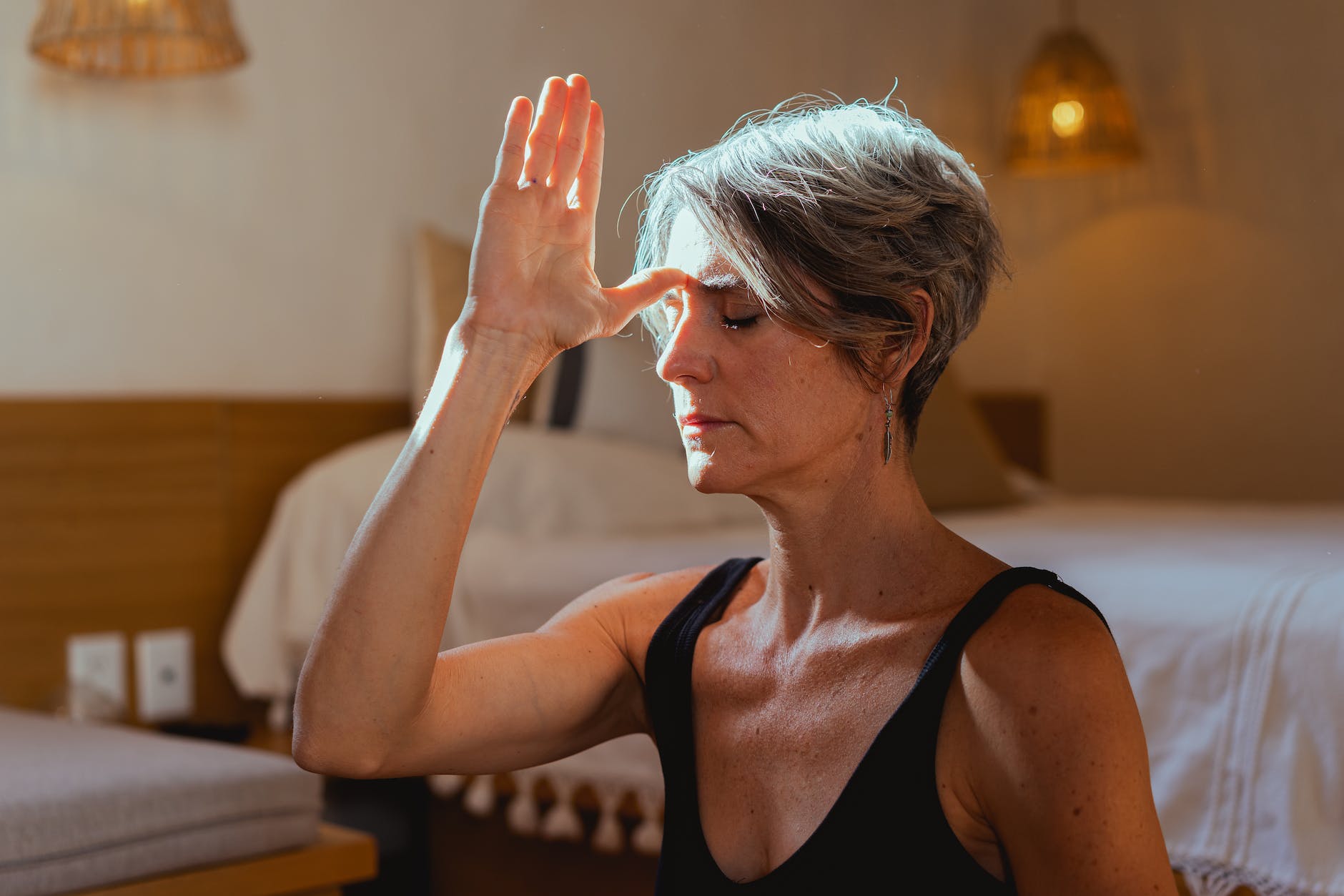 elderly woman meditating, considering personalized meditation, meditation goals, stress reduction, daily mindfulness, and meditation practice