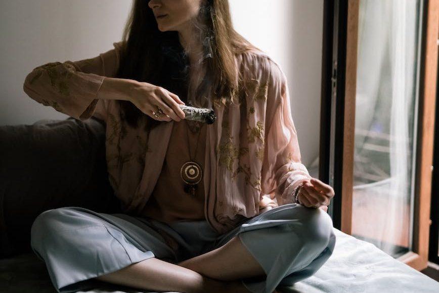woman in brown jacket sitting on chair
