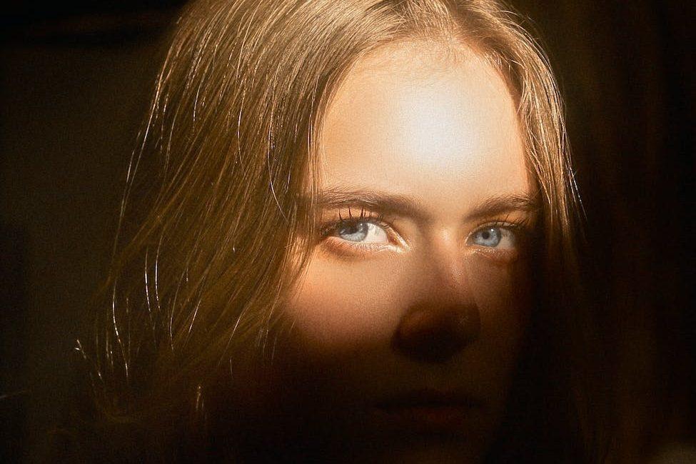 millennial model with blue eyes and shade on face