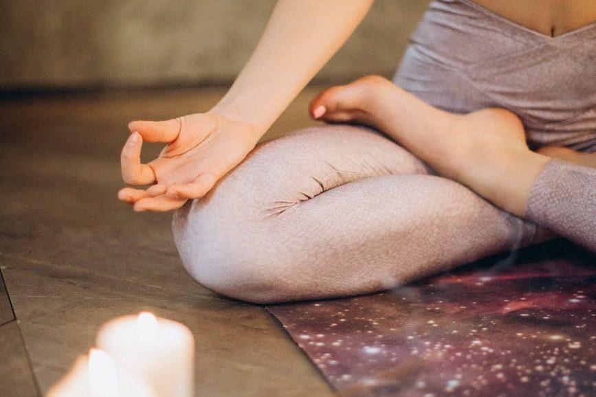 meditating with candles and incense, illustrating lunar cycle, moon rituals, moon phases meaning, lunar wisdom, and working with the moon