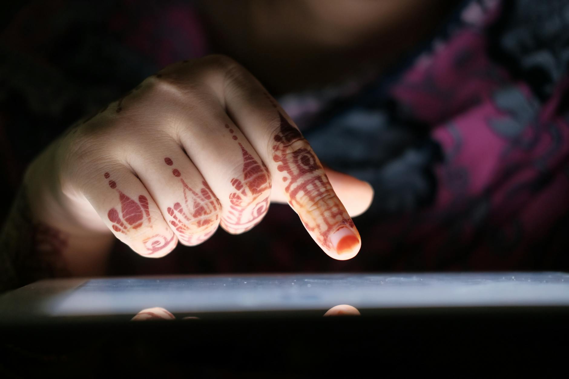 womans hand painted in traditional hindu patterns