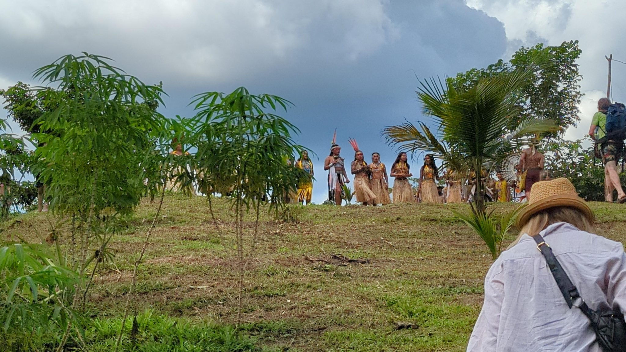 Huni Kuin women dance in traditional garb to welcome visitors to their village in Amazonia. Photo by mayryanna.