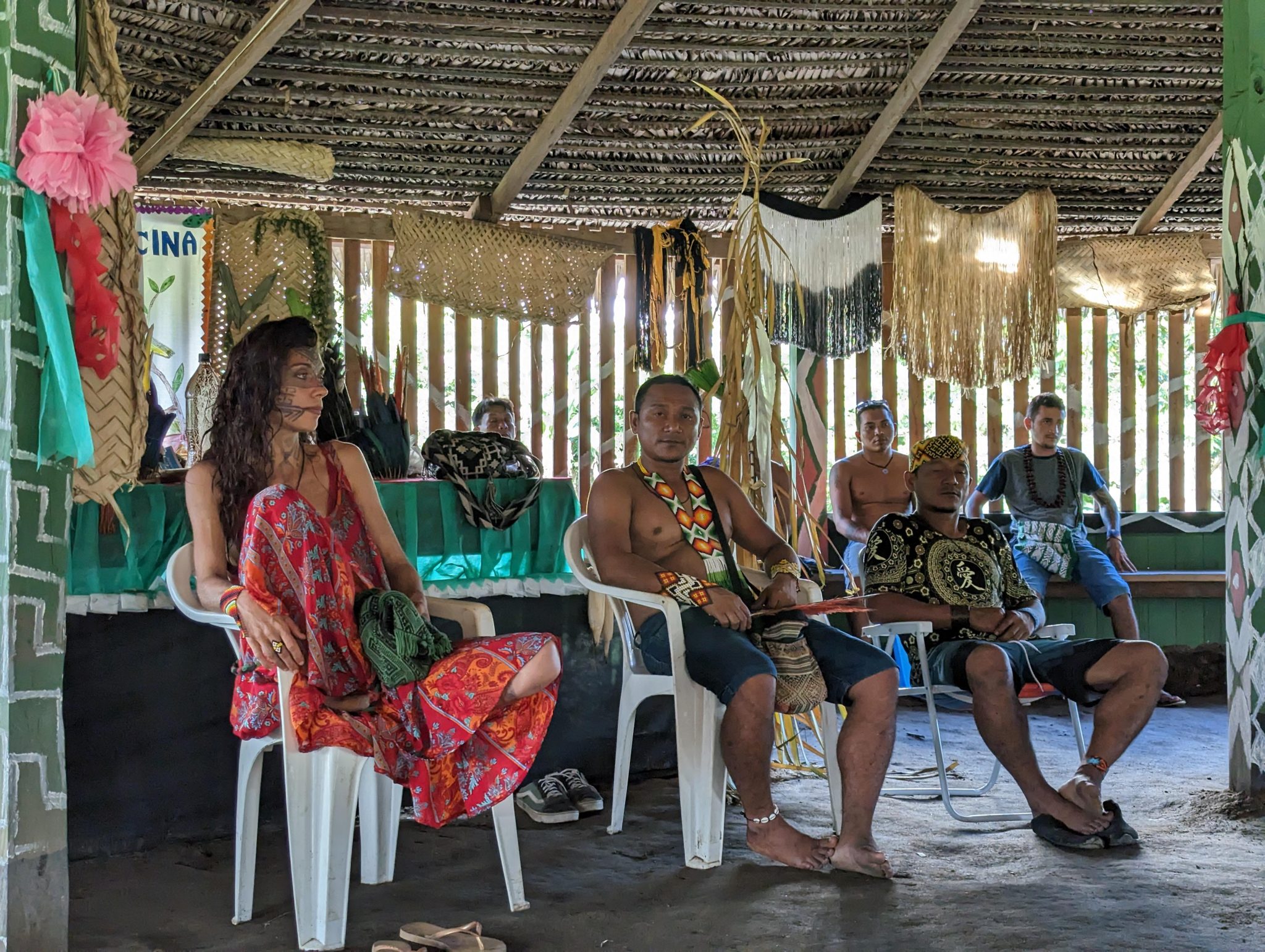 Intercultural translator and Huni Kuin twin shamans in the Txana Huya sacred maloca, Shabua. Photo by mayryanna.