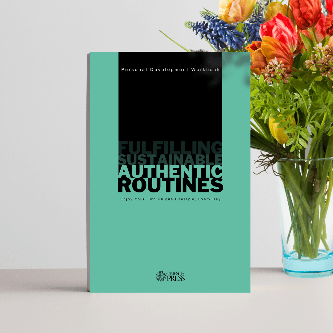 Authentic Routines Workbook sitting on a table in fron of a vase of flowers.