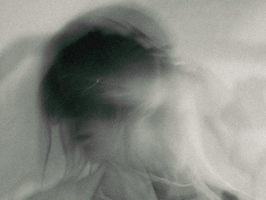 black and white blurry abstract photo of a woman, evoking: Friday the 13th, Divine Feminine Forgotten Wisdom, Lunar Wisdom, and and Goddesses