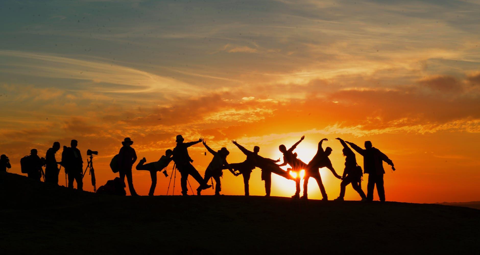 silhouette of people during golden hour, illustrating: Libra, the Autumn Equinox, balance, harmony, and Hellenistic Astrology