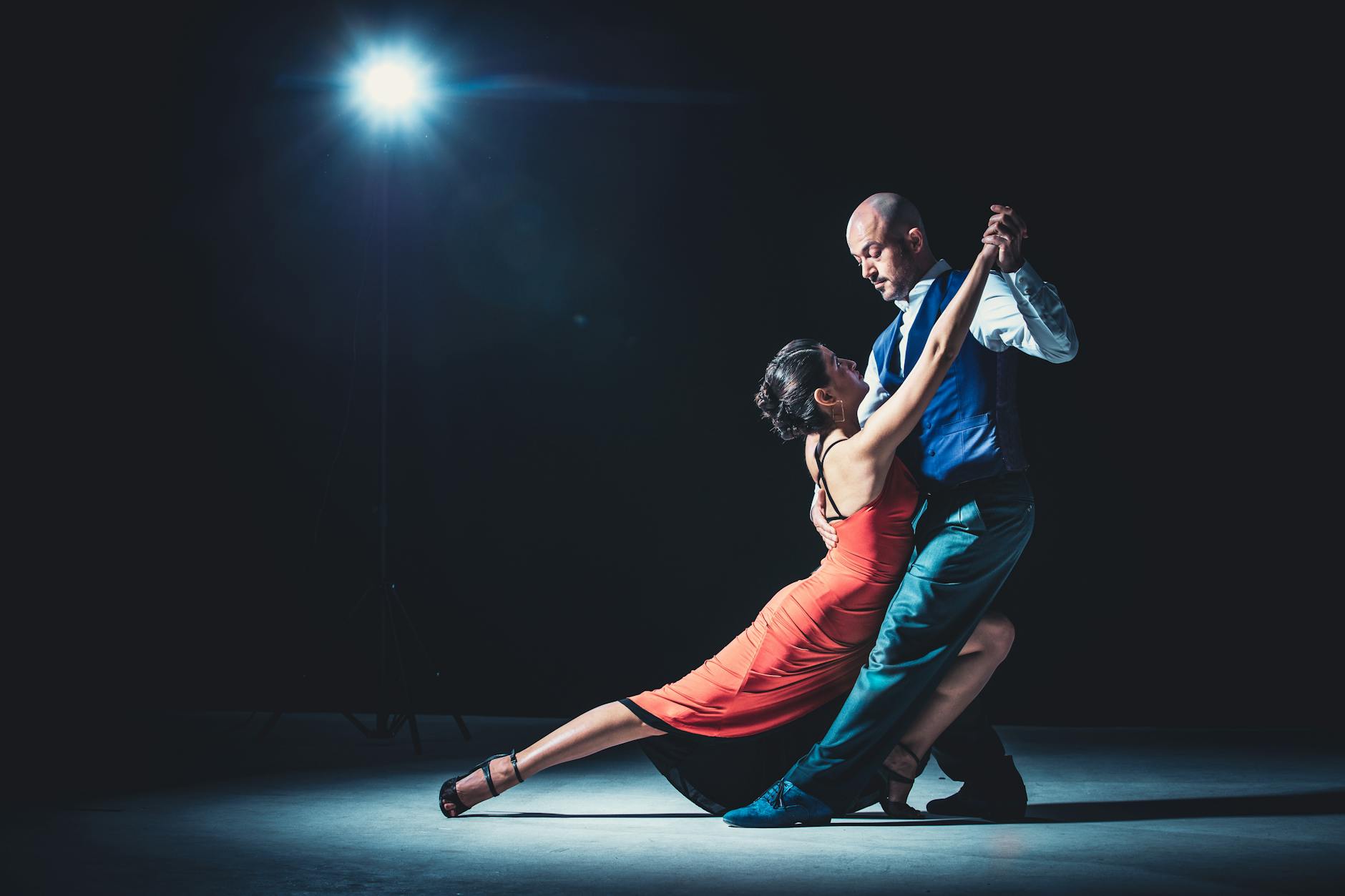 woman and man dancing under light, illustrating: Libra, the Autumn Equinox, balance, harmony, and Hellenistic Astrology
