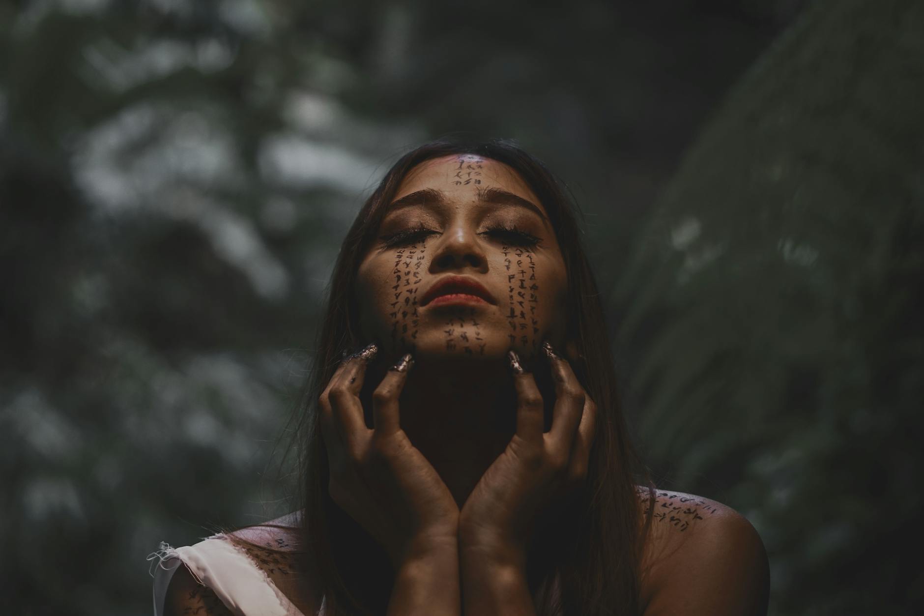 shallow focus photo of woman with face art, evoking: lost wisdom of the zodiac, Hellenistic astrology, and ancient astrology