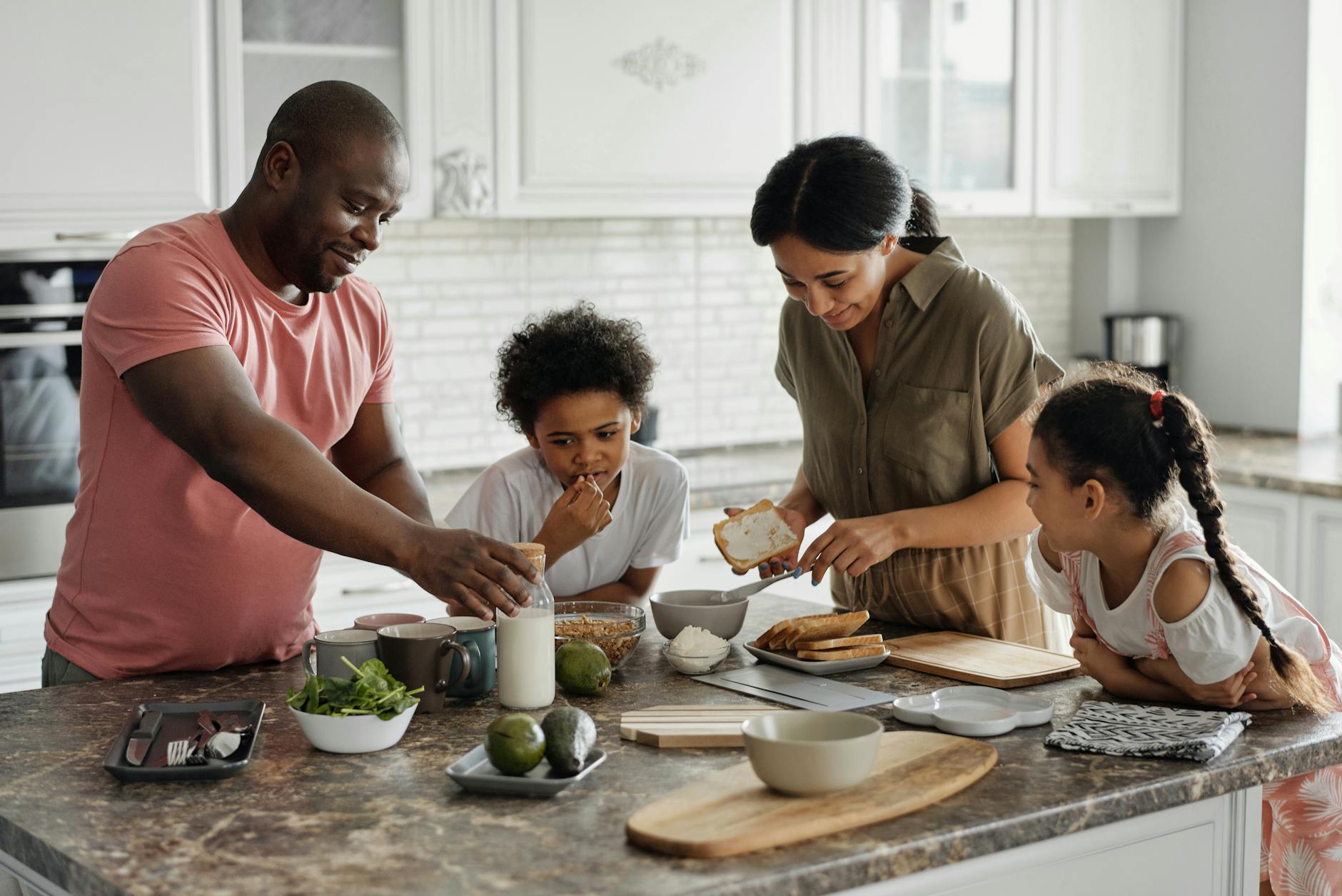 family making breakfast in the kitchen, illustrating: holidays, rituals, holiday ritual, seasonal tradition, and traditions