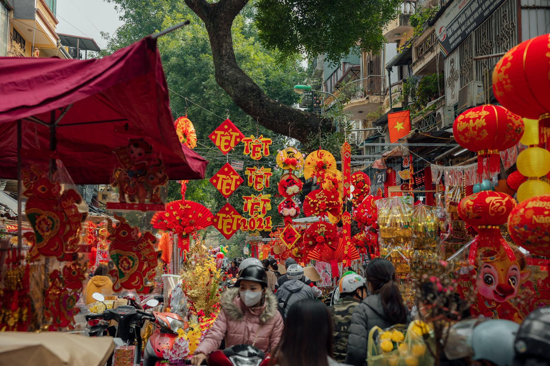 people in the market, illustrating: the universally sacred, Wheel of the Year, holy days, global perspective, and seasonal festivals