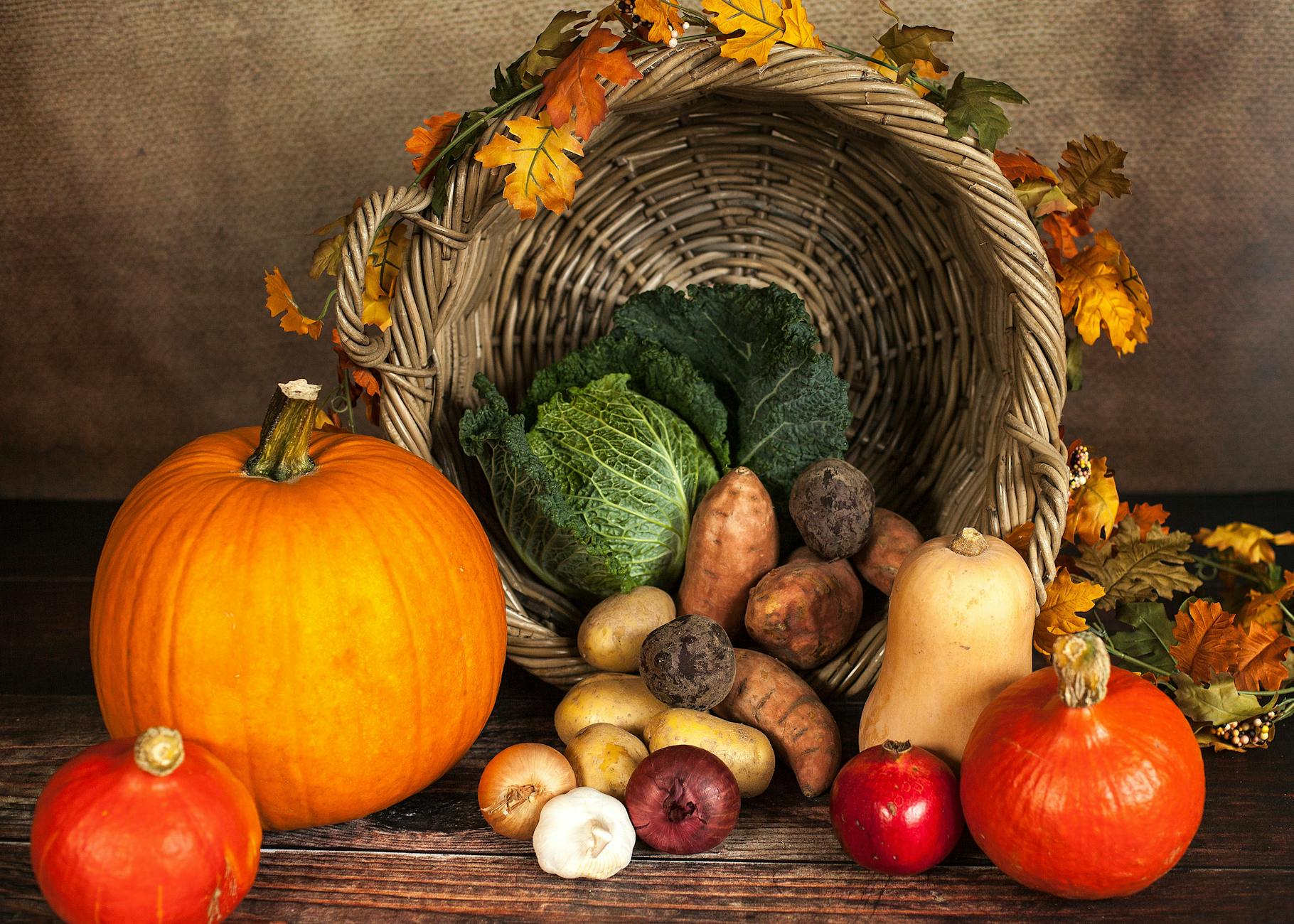 vegetable and crops beside spilled basket, illustrating: Samhain, Harvest Season, Stew Recipe, Nourishing Dish, and a Samhain Feast