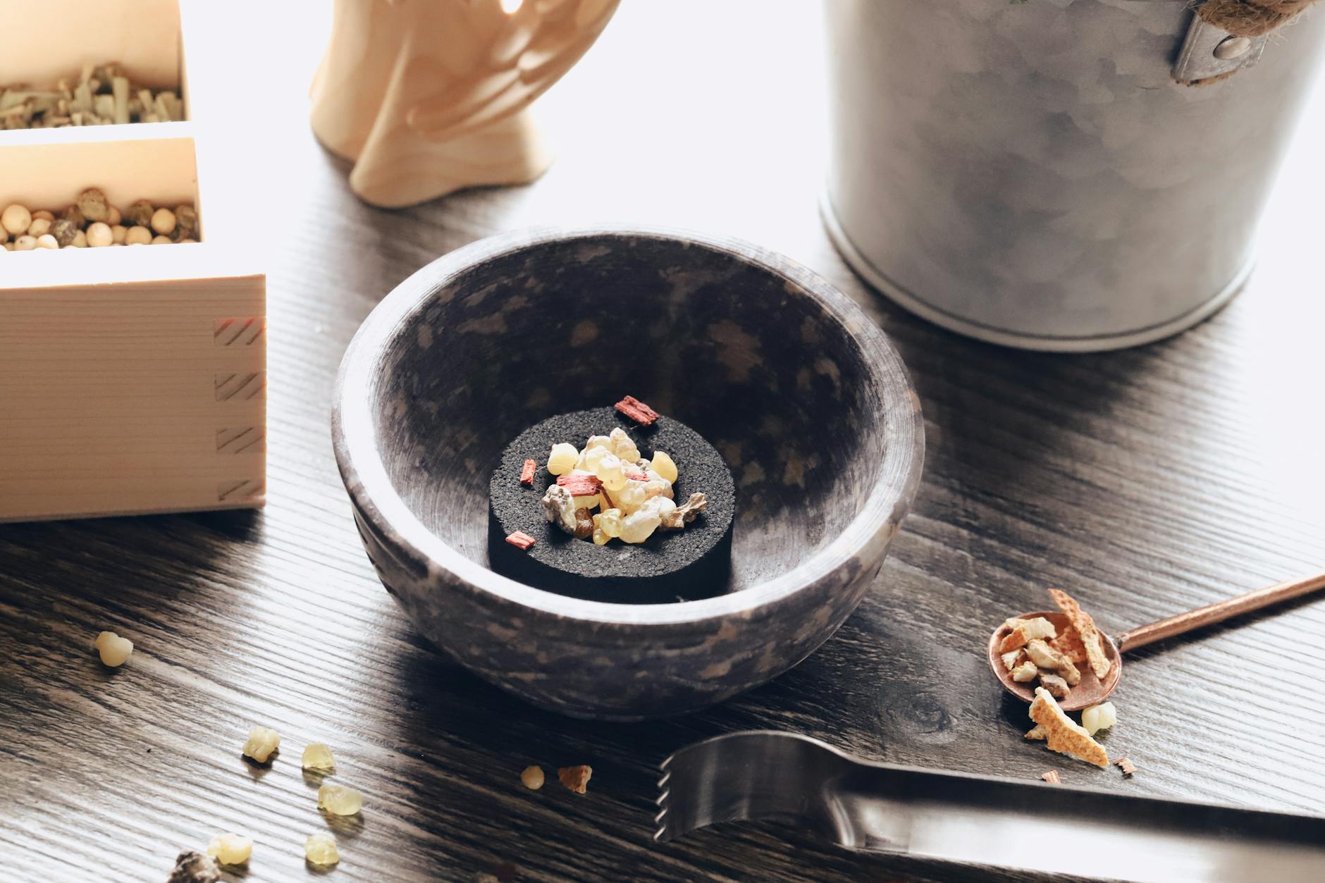 ingredients in bowl, evoking: sacred incense, incense for Samhain, ritual incense blend, herbal incense recipe, and ancestor offering incense