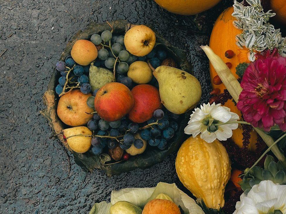 autumn harvest pumpkins fruits and flowers, evoking: Thanksgiving, gratitude, cultural traditions, global, and giving thanks