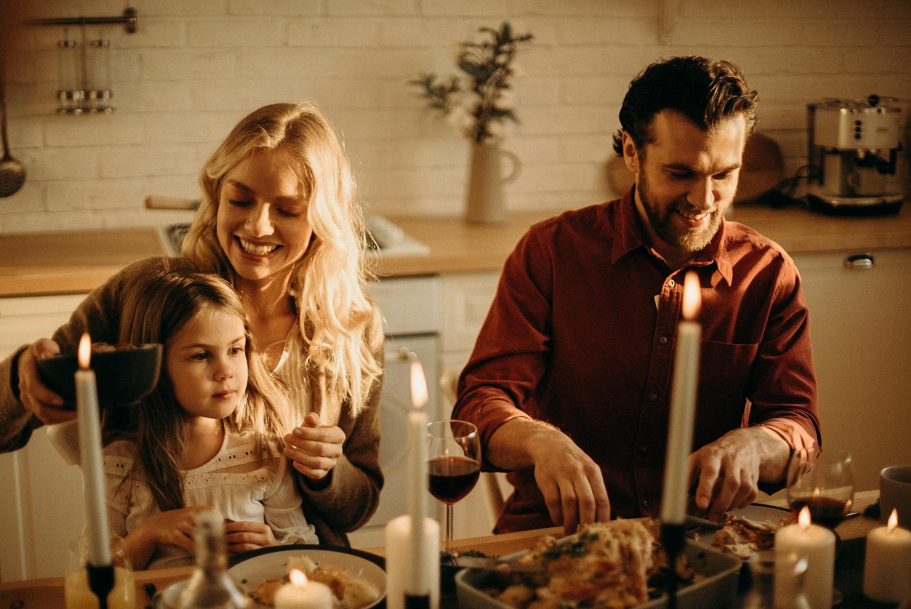 family having meal at the table, illustrating: gratitude, heart-brain coherence, abundance mindset, reciprocity, and wellbeing