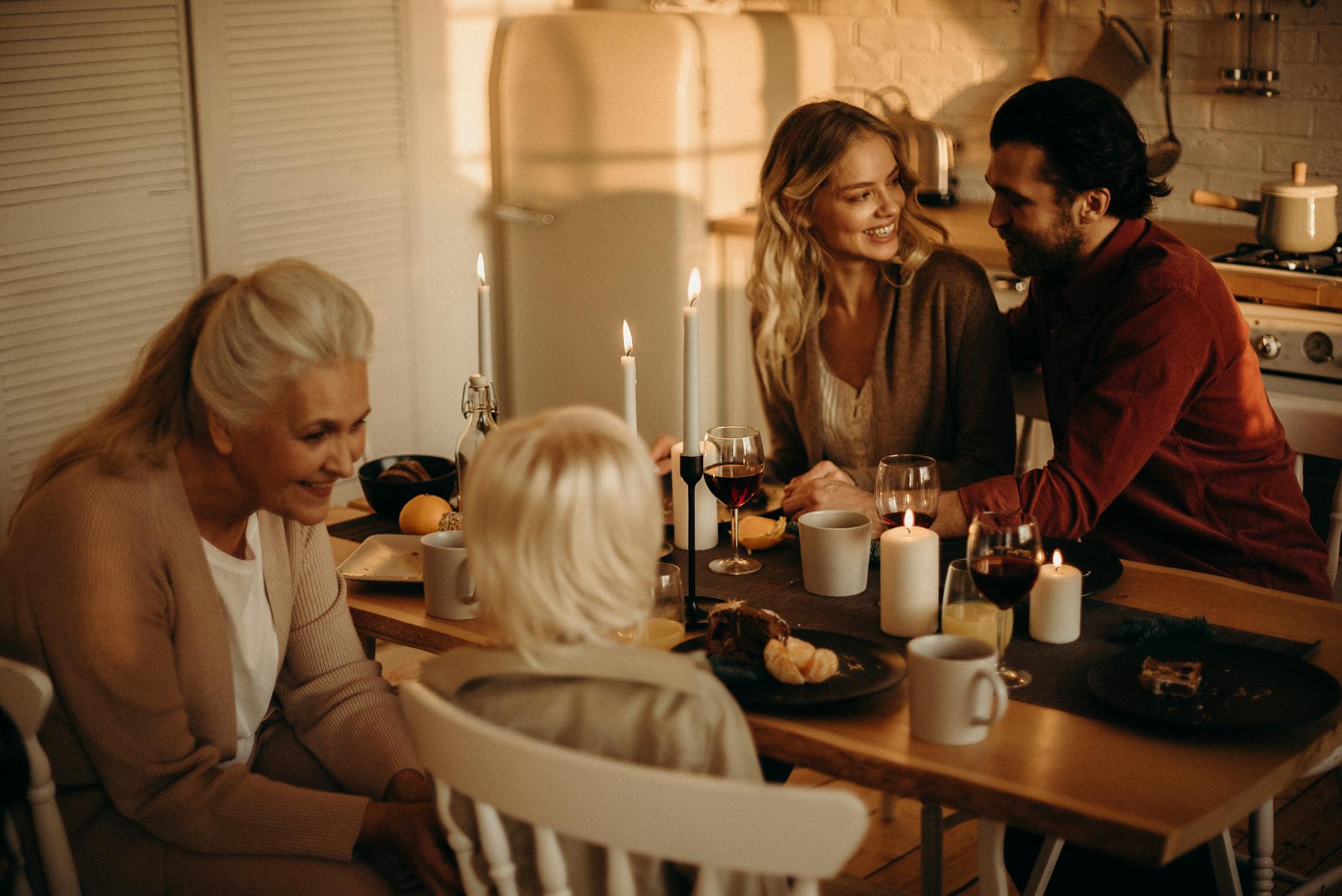 people sitting on chairs by the dining table, illustrating: gratitude, heart-brain coherence, abundance mindset, reciprocity, and wellbeing