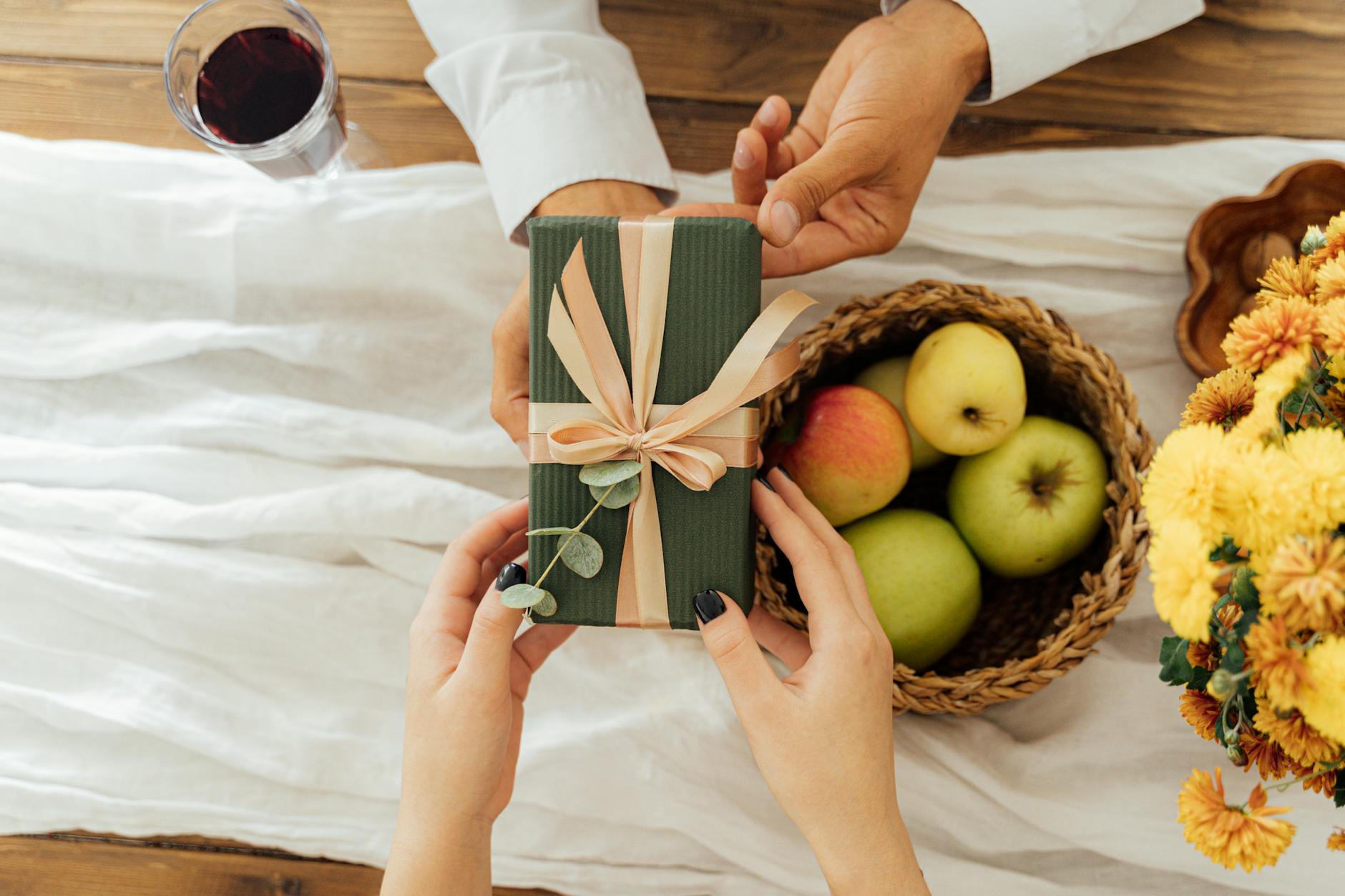 person giving a gift box, illustrating: gratitude, heart-brain coherence, abundance mindset, reciprocity, and wellbeing