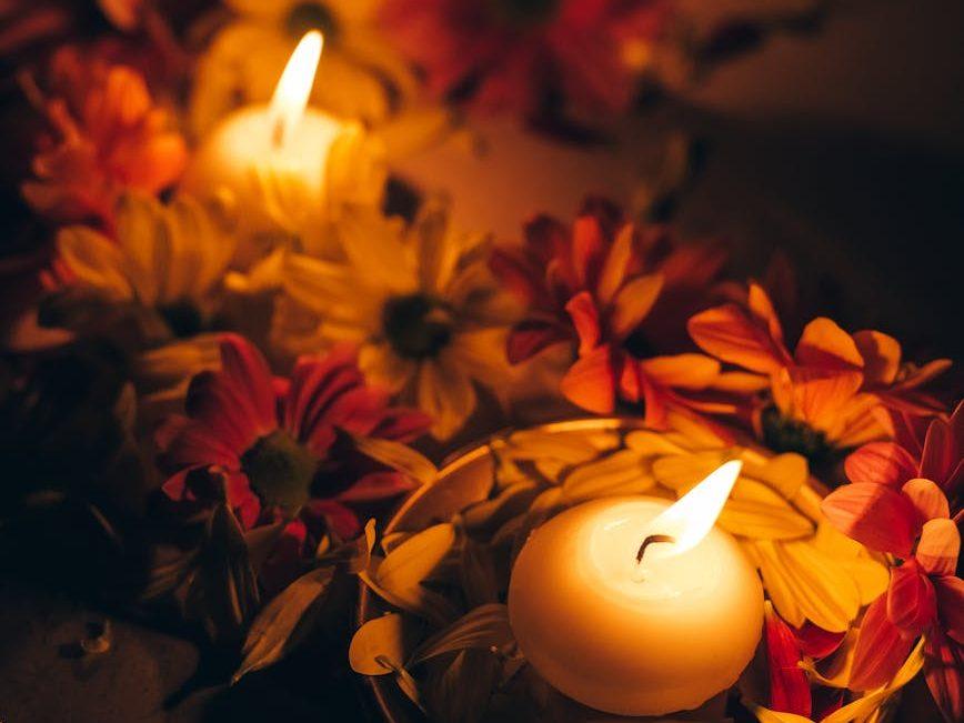 lighted candles candles and flowers for diwali, evoking: Sagittarius, Sagittarius season, Hellenistic astrology, Zodiac, and wisdom