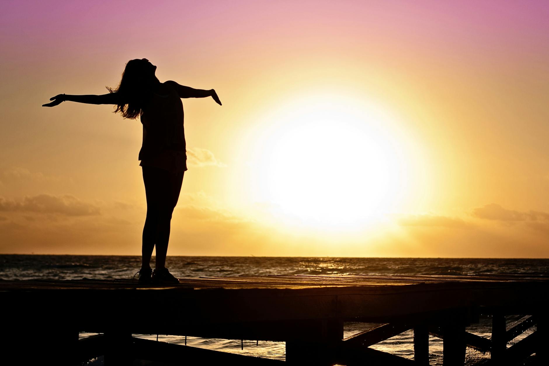 silhouette photo of woman against during golden hour, evoking: Sagittarius, Sagittarius season, Hellenistic astrology, Zodiac, and wisdom