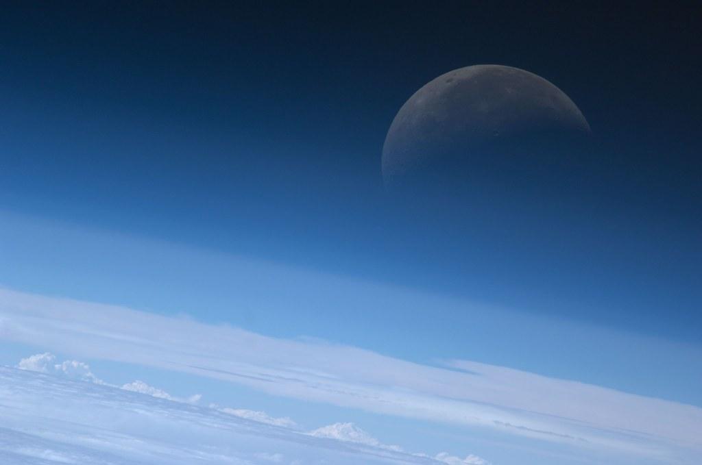 Moon Over Earth (Archive: NASA, International Space Station, 10/12/09); evoking: astrology, planetary transits, zodiac signs, birth chart, and moon phases