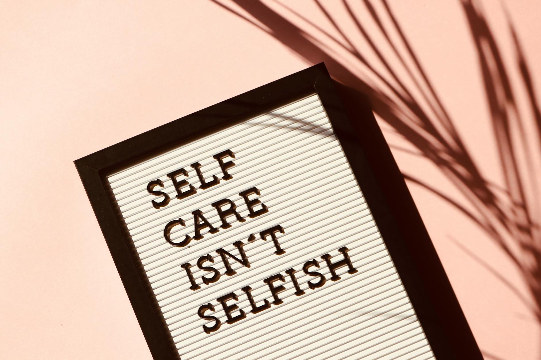 self care isn't selfish signage, encouraging a daily mindfulness pactice