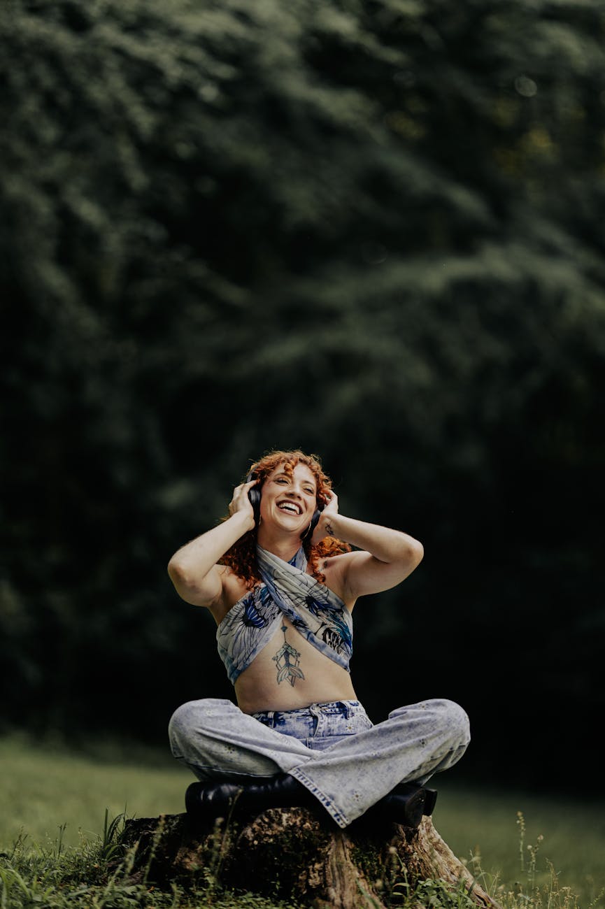 joyful woman enjoying nature music outdoors in mindfulness practice for self-care