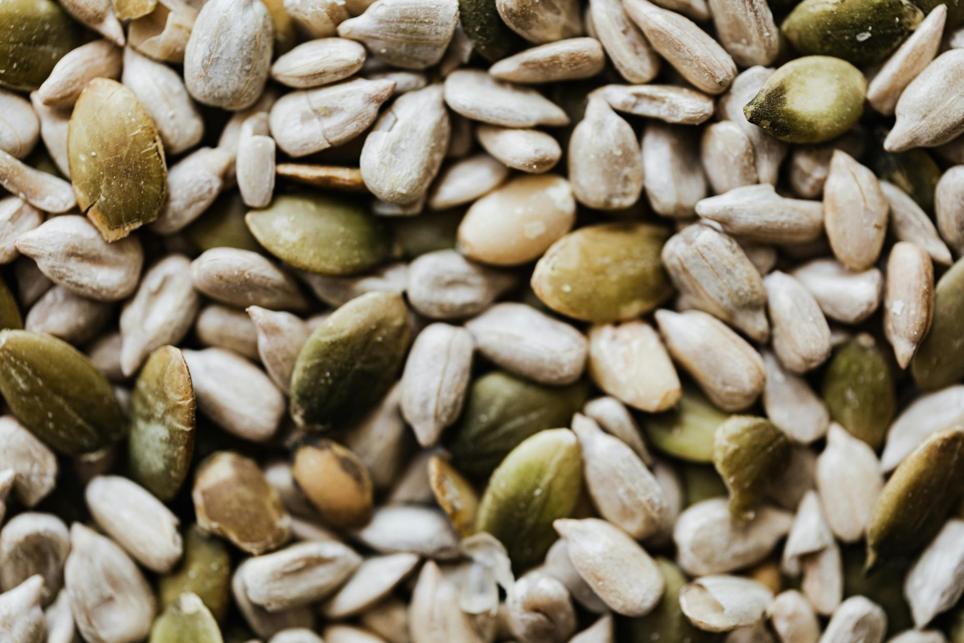 pile of sunflower seeds for sunflower seed bread, a Litha recipe for celebrating Litha as a kitchen witch