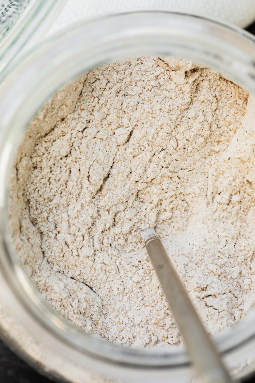 whole wheat flour close up, inviting us to make sunflower seed bread, a Litha recipe for celebrating Litha as a kitchen witch