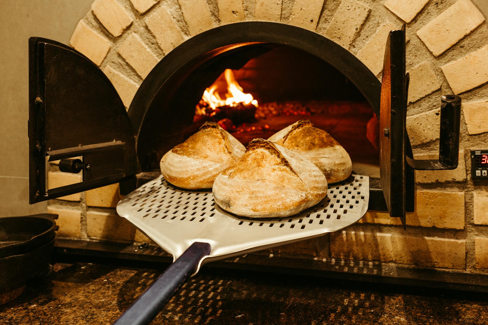 bread on black metal grill, expressing Leo energy in Leo season as the fixed fire sign is represented by Hellenistic Astrology and the Wheel of the Year
