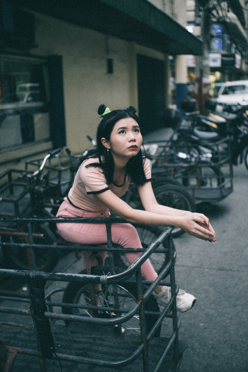 woman sitting on bike, considering personalized meditation, meditation goals, stress reduction, daily mindfulness, and meditation practice