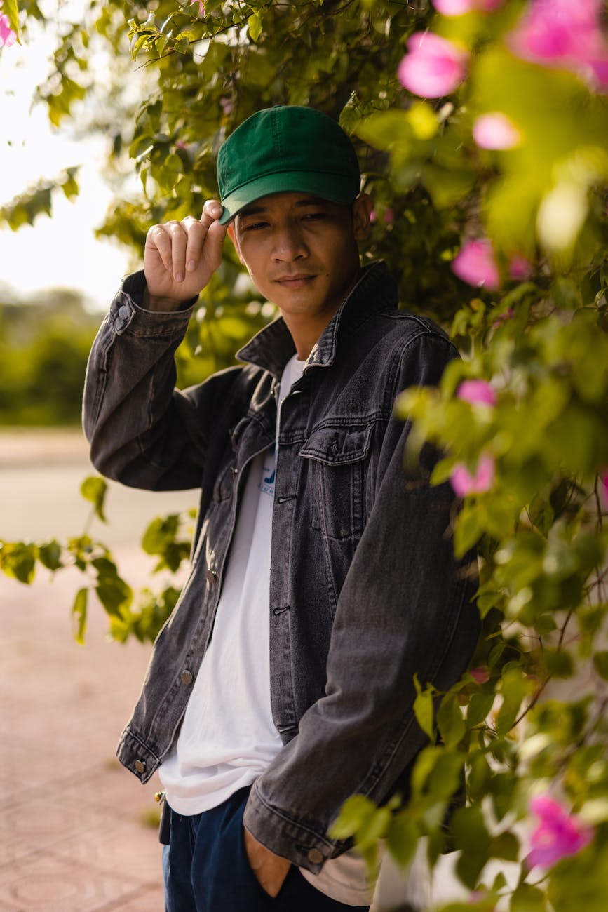 casual portrait among vibrant bougainvillea, considering spiritual connection, meditation practice, mindfulness and intuition, connect with higher self, and meditation for inner peace