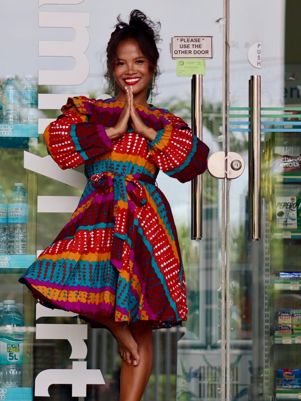 colorful portrait of smiling woman in philippines, considering spiritual connection, meditation practice, mindfulness and intuition, connect with higher self, and meditation for inner peace