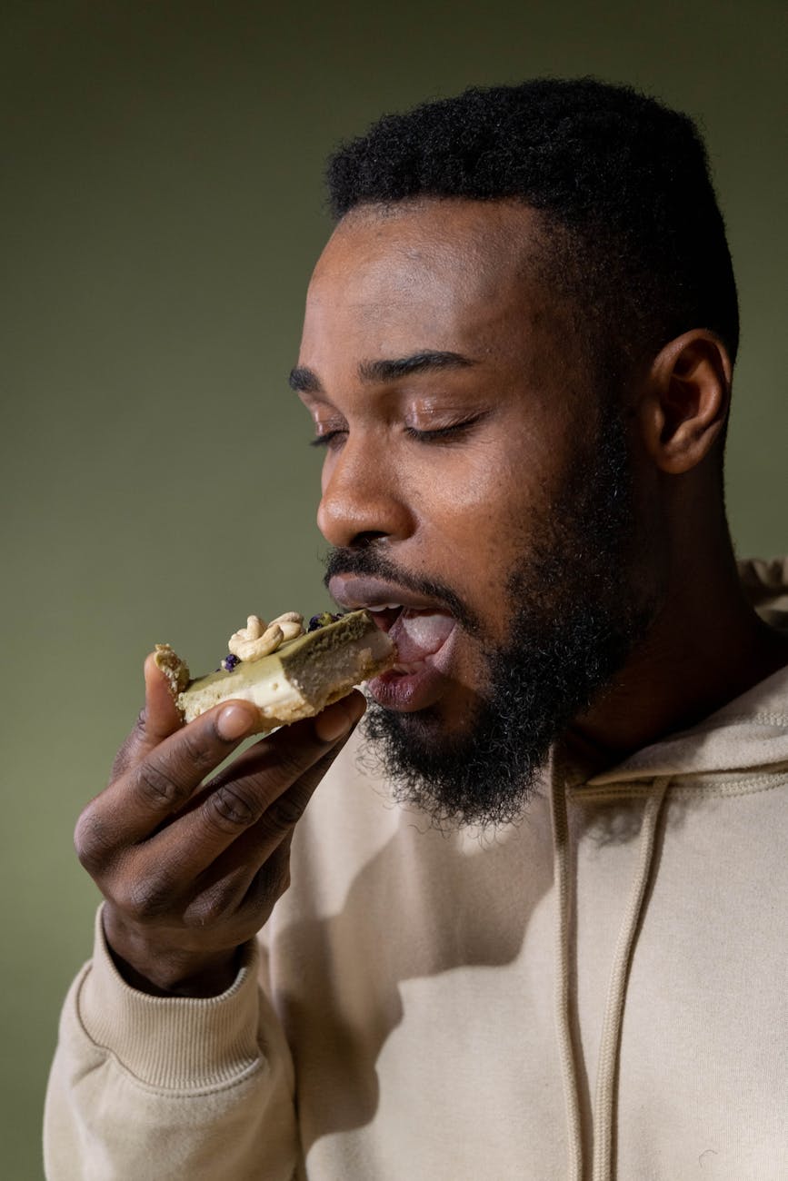 a man eating a layered cake, contemplating meditation for daily life, mindfulness routines, daily meditation practice, mindfulness habits, and how to integrate meditation