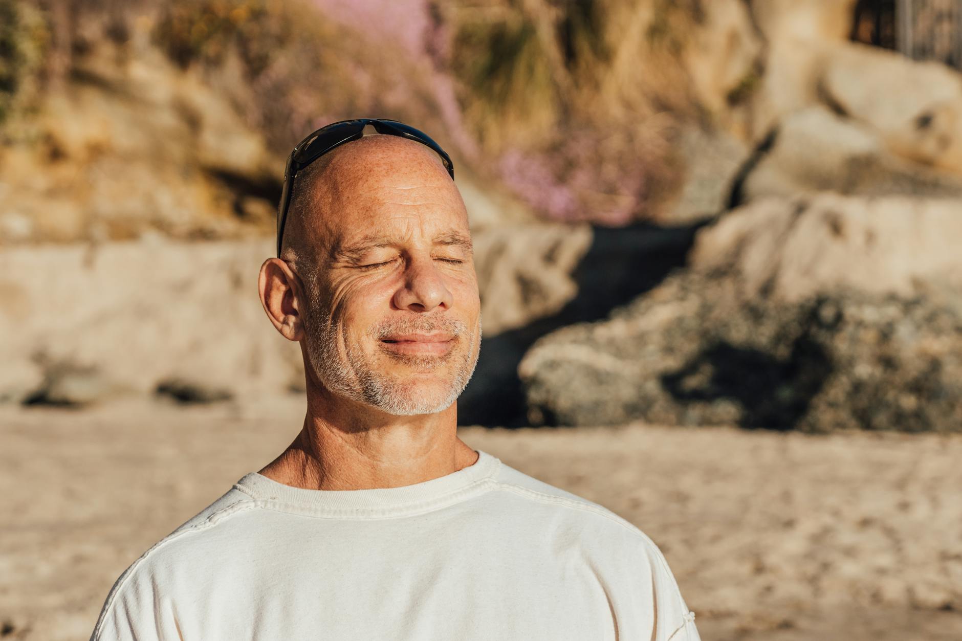 a man sitting on the sand, evoking advanced meditation techniques, deep meditation practice, meditation journey, advanced mindfulness, and spiritual growth meditation