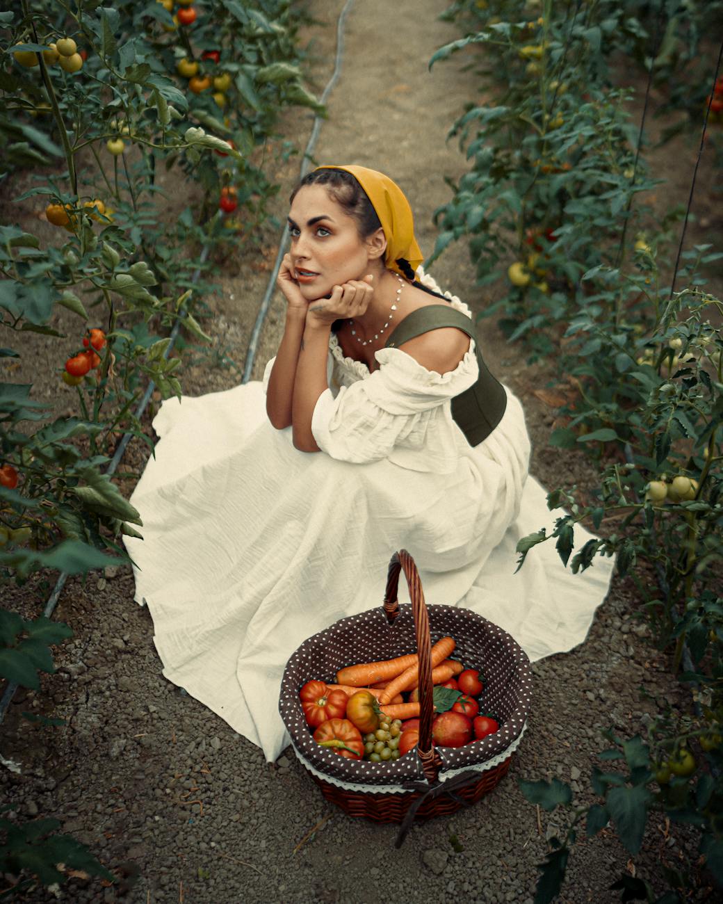 woman in a tomato field with harvest basket, illustrating: Ma'at, Egyptian goddess, Libra archetype, goddess of truth, cosmic harmony, and balance