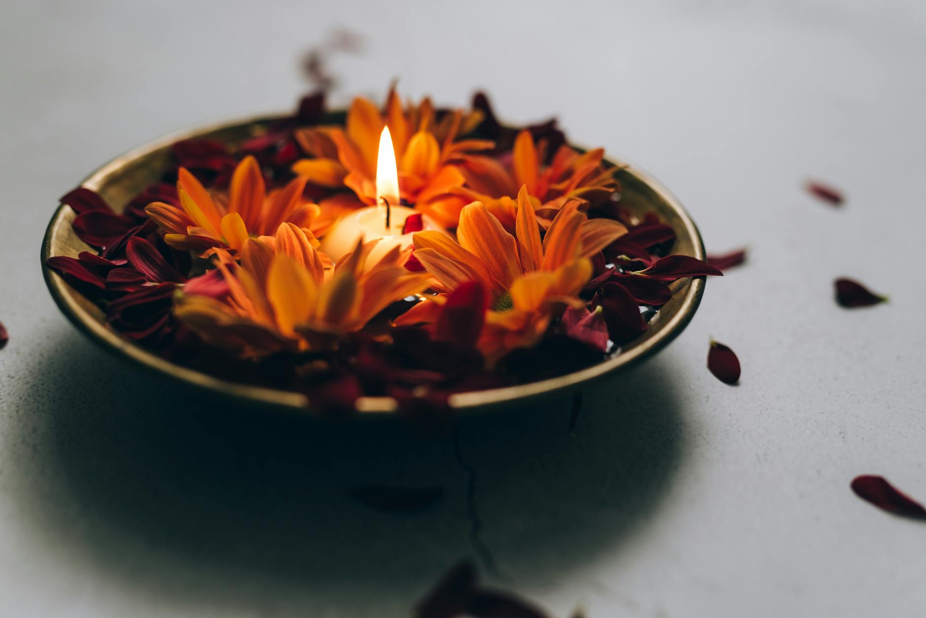 a burning candle in a bowl, illustrating: Mabon divination, inner wisdom, Tarot spread, harvest reflection, and the Autumn Equinox