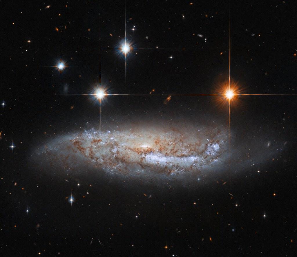 Hubble Views a Galaxy With an Explosive Past, evoking: lost wisdom of the zodiac, Hellenistic astrology, and ancient astrology