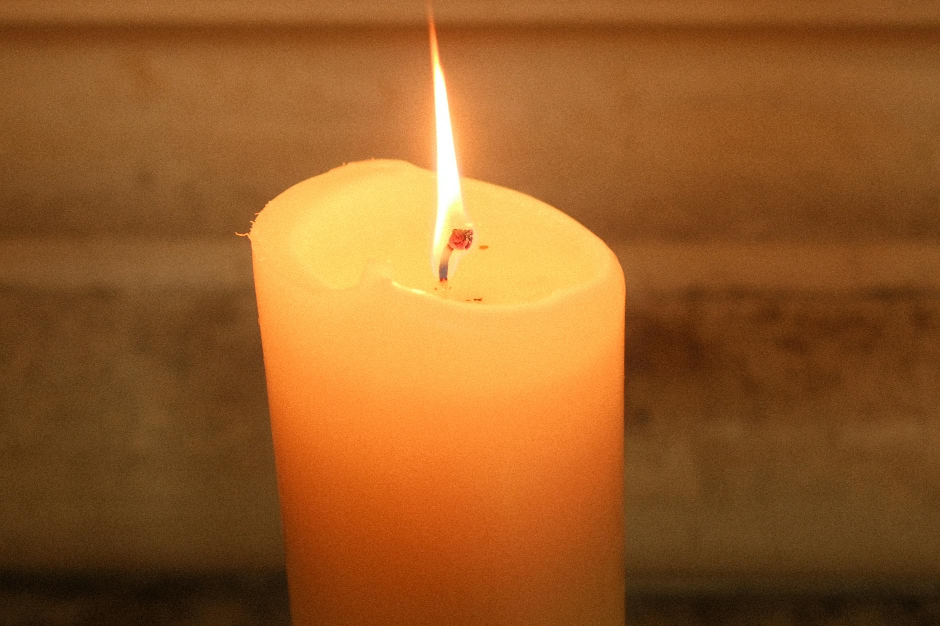 tranquil burning candle with warm glow