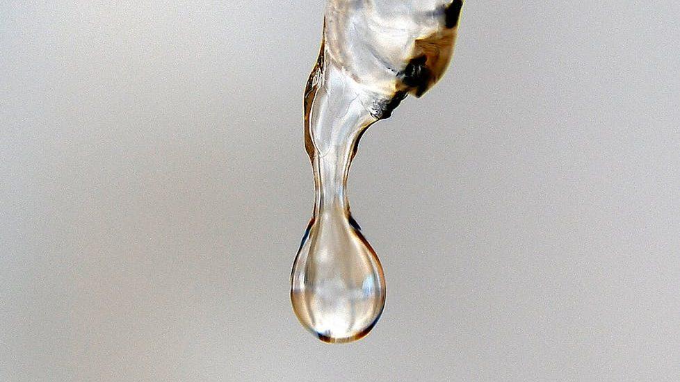 close up of melting ice, evoking: winter solstice, end of the year, seasonal awareness, yearly cycle, and clarity