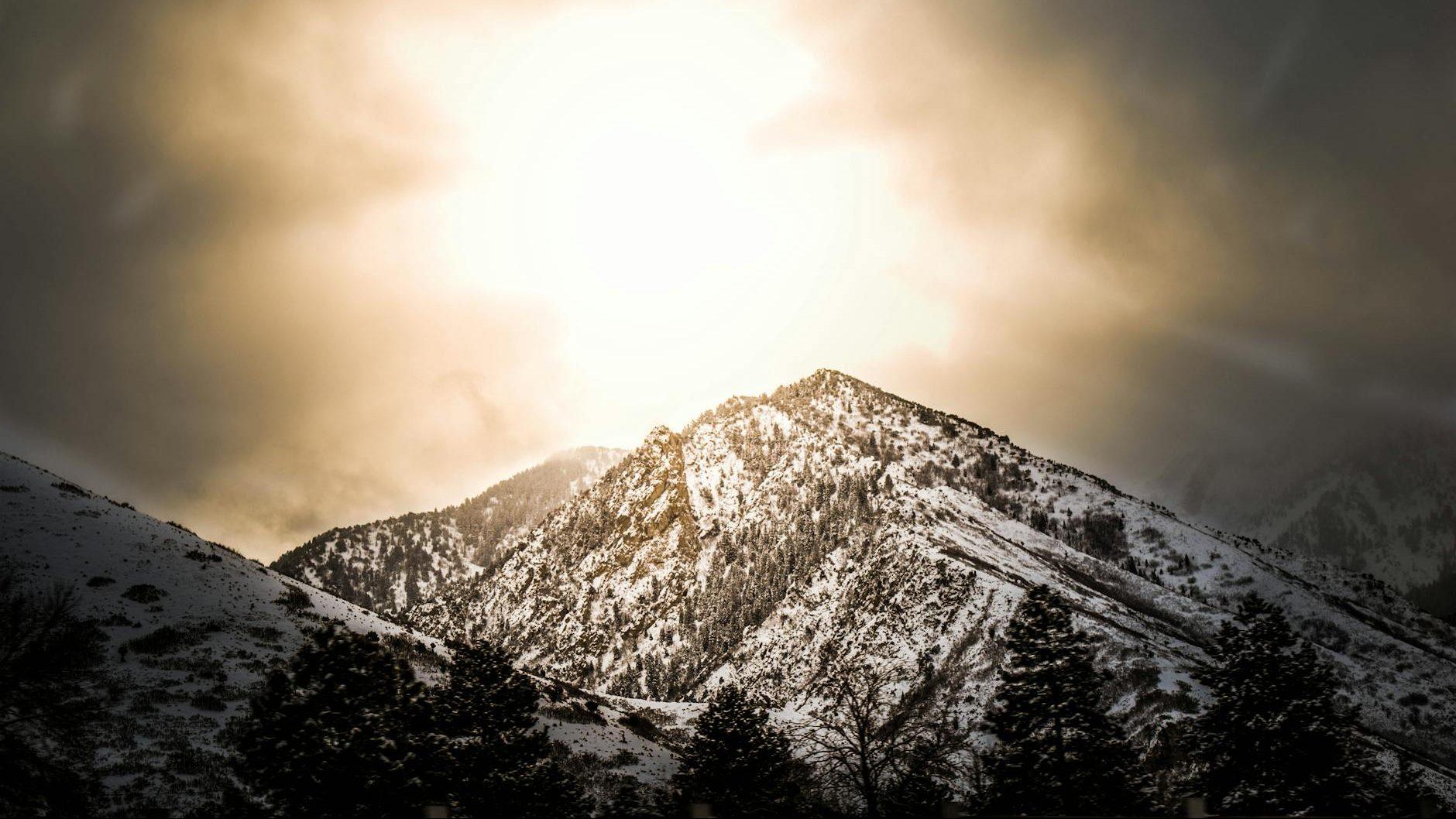 white and black mountain photo during sunset, evoking: Capricorn, winter solstice, zodiac, astrological sign, and the solar cycle