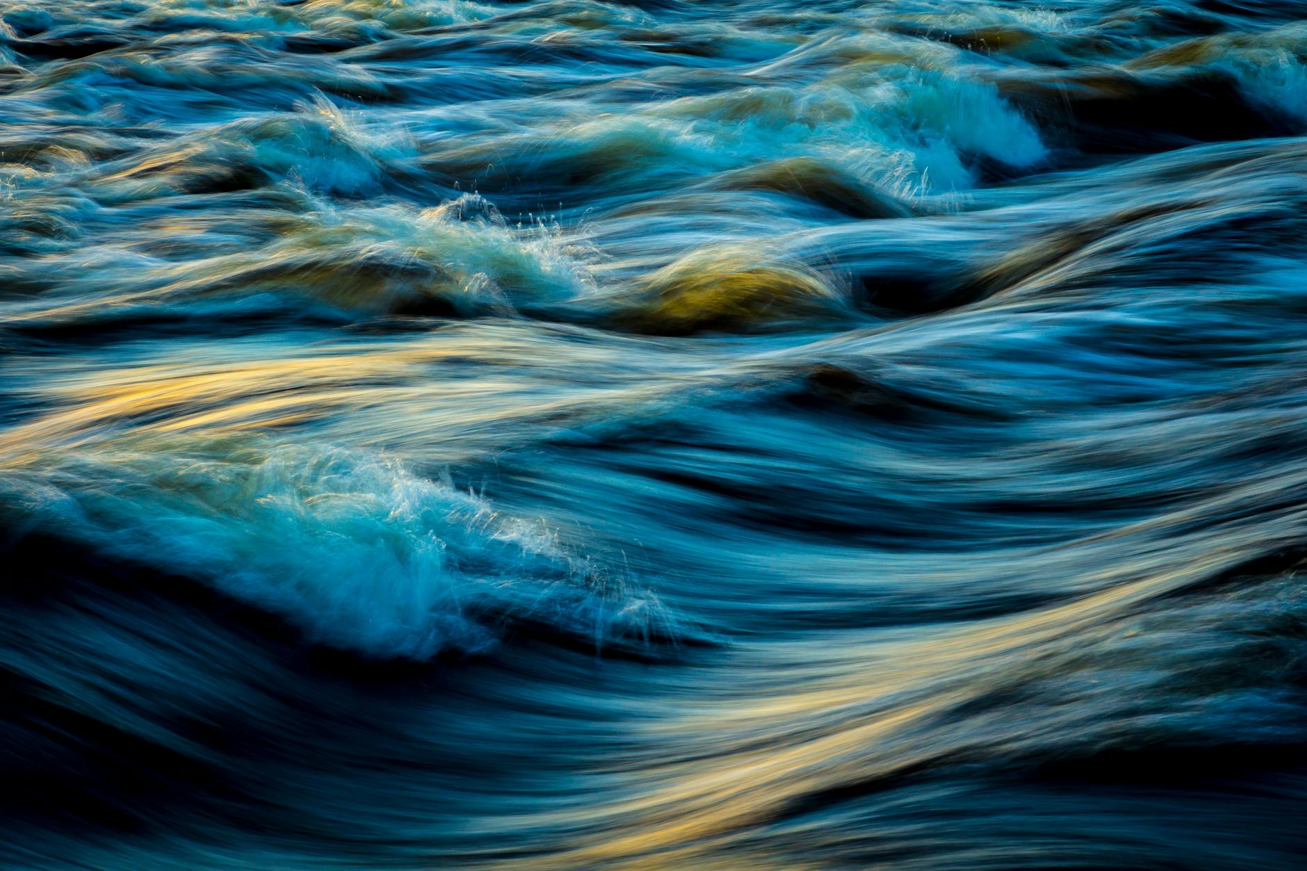 macro photography of water waves, illustrating: Pisces energy, total dissolution, return of light, Pisces zodiac sign, and Pisces season