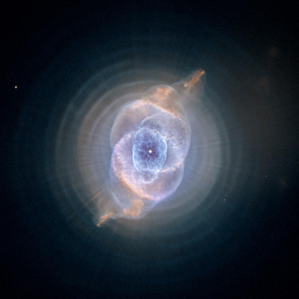Cat's Eye Nebula; evoking: astrology, planetary transits, zodiac signs, birth chart, and moon phases
